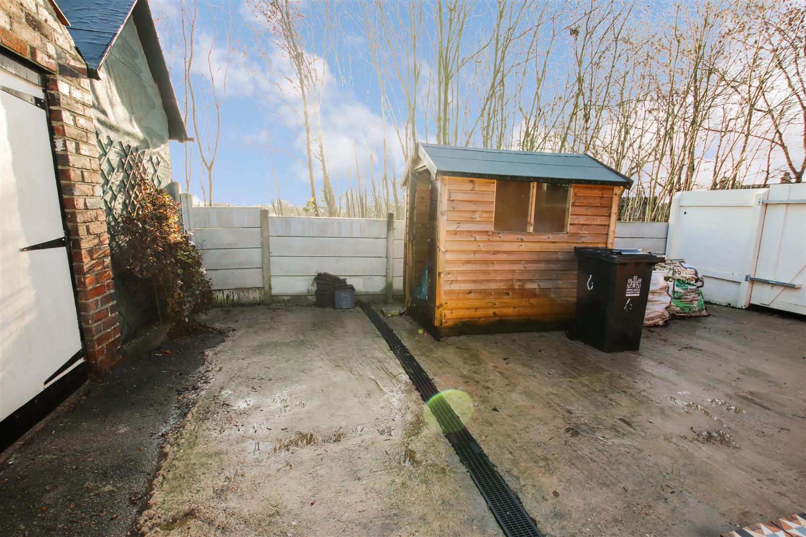 SECURED YARD AREA WITH ACCESS TO GARAGE